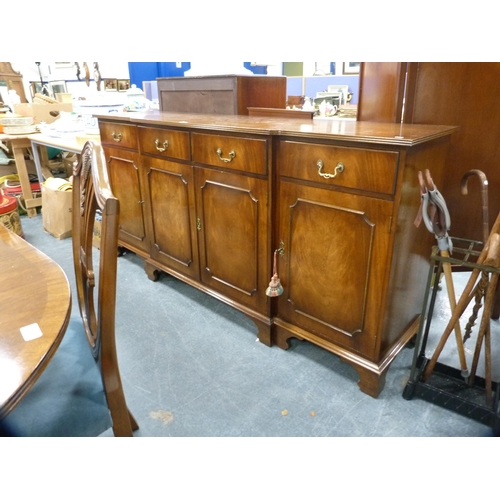 423 - Bevan-Funnell Reprodux composite mahogany dining room suite comprising a breakfront sideboard, twin-... 