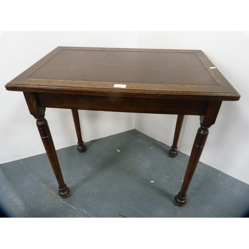 429 - Oak writing table with inset leather top.