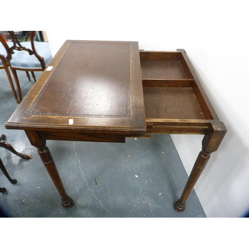 429 - Oak writing table with inset leather top.