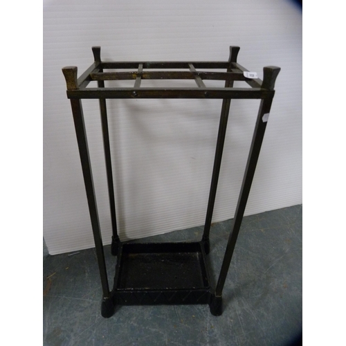 438 - Metal stick stand and contents.