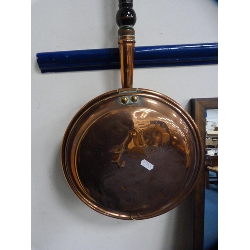 44 - Copper bed warming pan and an oval gilt mirror.  (2)