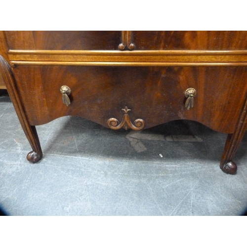 443 - Mahogany tallboy enclosed by cupboards and drawers.