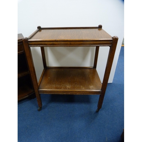 458 - Small mahogany open bookcase with two drawers above and an oak tea trolley.  (2)