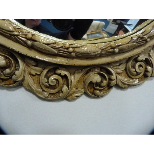 47 - Ornate circular wall mirror.