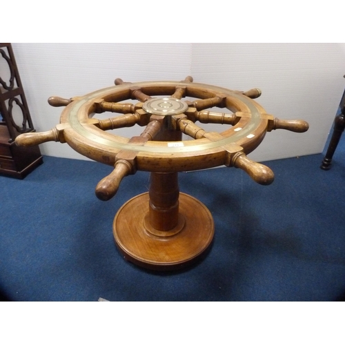 471 - Ship's wheel coffee table with brass mounts.