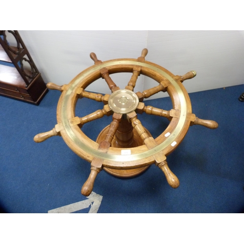 471 - Ship's wheel coffee table with brass mounts.