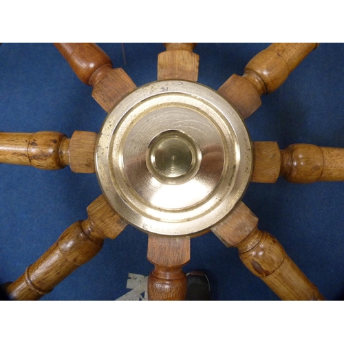 471 - Ship's wheel coffee table with brass mounts.