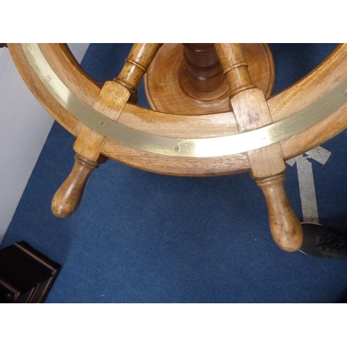 471 - Ship's wheel coffee table with brass mounts.