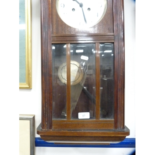 57 - Oak-cased wall clock.