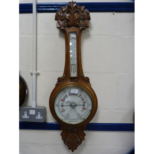 64 - Carved oak aneroid barometer.