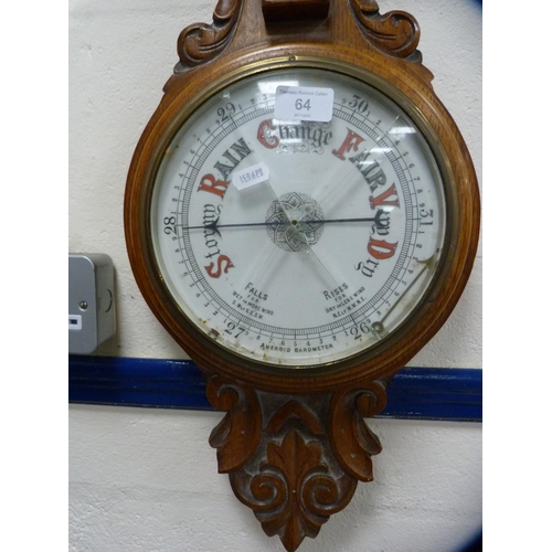 64 - Carved oak aneroid barometer.