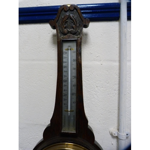 65 - Carved oak barometer.