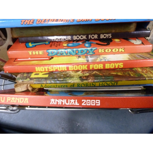 70 - Collection of children's annuals, Beatrix Potter books, and a briefcase containing watch straps.