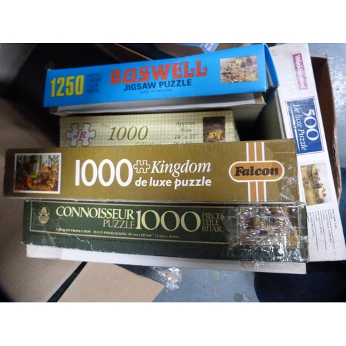 83A - Box of assorted jigsaw puzzles and a carton of general books, Stanley Gibbons stamp album etc.