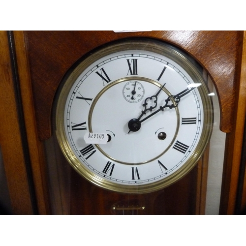 88 - Reproduction twin train wall clock with subsidiary seconds dial, with two brass-coated weights.