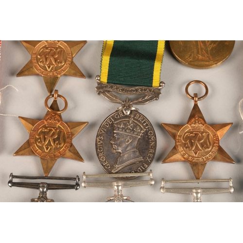 54 - Various WW1 and WW2 medals to include a Territorial Medal for Efficient Service awarded to Corporal ... 