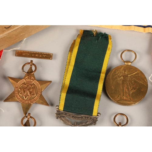 54 - Various WW1 and WW2 medals to include a Territorial Medal for Efficient Service awarded to Corporal ... 