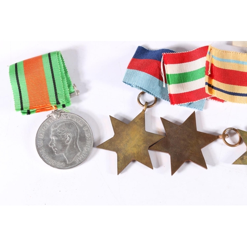 780 - WWII war medals including Defence medal, WWII war medal, Africa star, Italy star and 1939-1945 star,... 