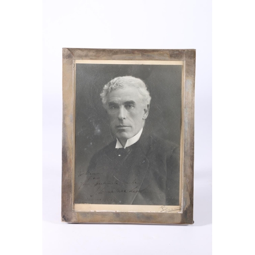 803 - Silver photograph frame, 25cm x 19cm, containing a portrait photograph of Sir John Lorne MacLeod GBE... 