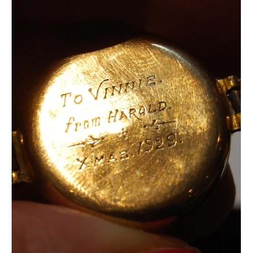 139 - Lady's 9ct gold backed wristwatch, engraved and dated 1929 to the back casing, on flexible rolled go... 