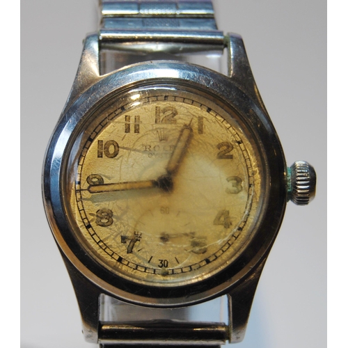 140 - Rolex Oyster wristwatch, c. 1930s, in stainless steel case with oatmeal dial, Arabic numerals and se... 