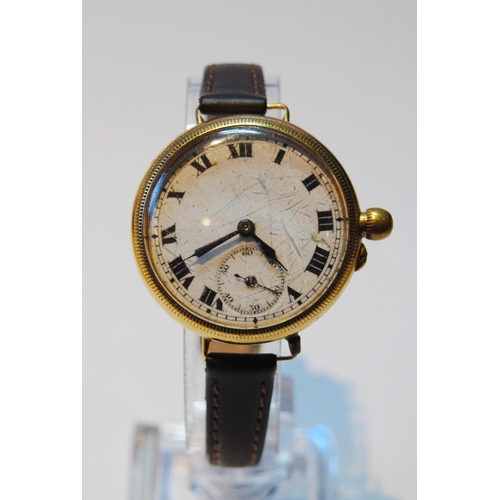 143 - 9ct gold backed wristwatch, c. 1920s, with white enamel dial, Roman numerals and seconds dial, case ... 