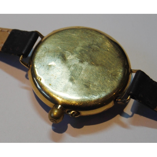 143 - 9ct gold backed wristwatch, c. 1920s, with white enamel dial, Roman numerals and seconds dial, case ... 