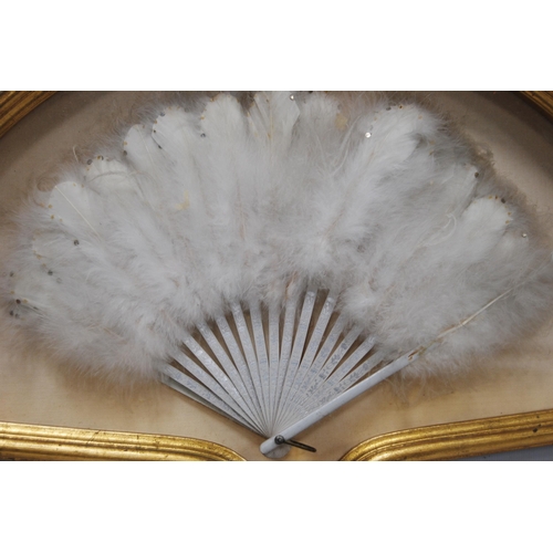 196 - Folding ostrich feather fan, c. early 20th century, on floral decorated bone sticks, enclosed in a g... 