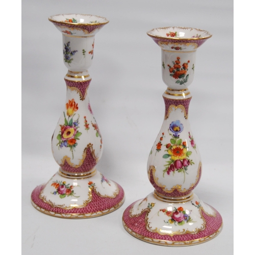 208 - Pair of Dresden porcelain candlesticks decorated with colourful underglazed floral sprays on white g... 