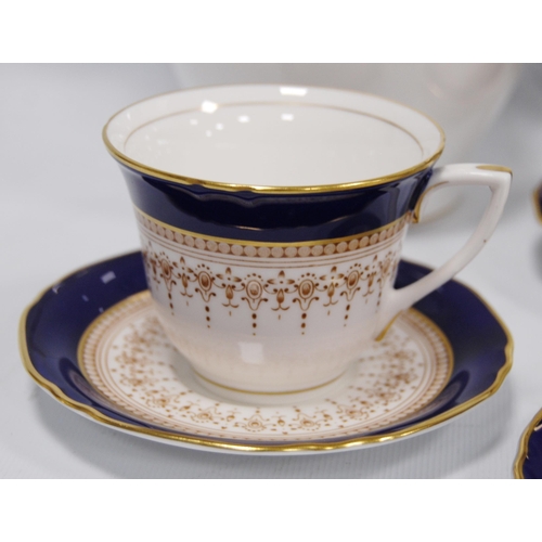 209 - Royal Worcester 'Regency' pattern cobalt blue tea, coffee and dinner set comprising two tureens, ova... 