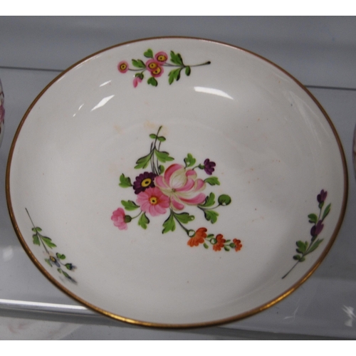 211 - Two 18th century porcelain tea bowls and saucers, probably by New Hall, decorated with hand-painted ... 