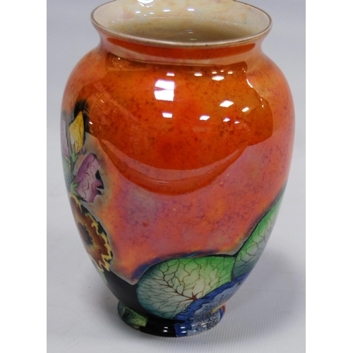 212 - Carlton Ware 'Hollyhocks' pattern lustre vase in colourful underglaze on an orange ground, 15cm high... 