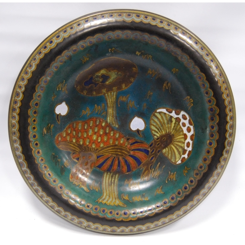 217 - Gouda Pottery shallow bowl, the well decorated with colourful toadstools within blue and gold rounde... 