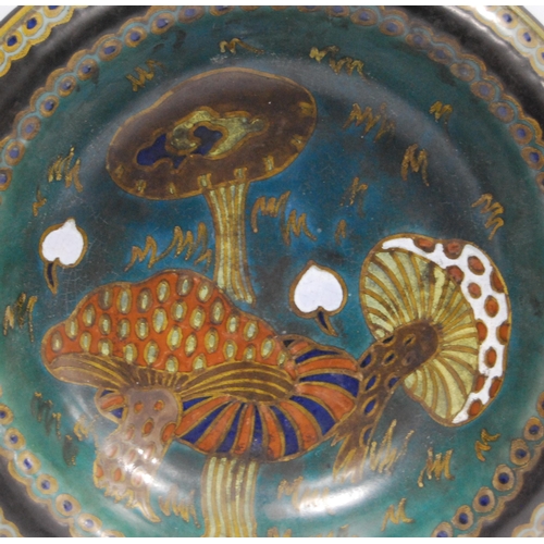 217 - Gouda Pottery shallow bowl, the well decorated with colourful toadstools within blue and gold rounde... 