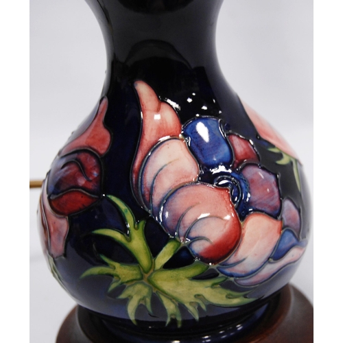 222 - Moorcroft 'Anemone' table lamp with tube lined decoration on a blue ground, fixed to base, 16cm high... 