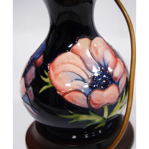 222 - Moorcroft 'Anemone' table lamp with tube lined decoration on a blue ground, fixed to base, 16cm high... 