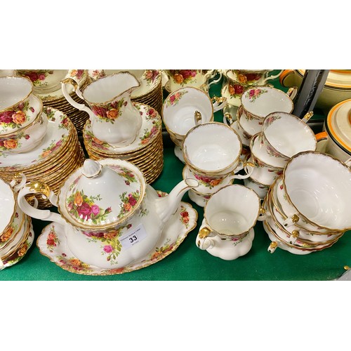 33 - Royal Albert Country Roses dinner set, including tea pot, eight soup bowls, twelve tea cups and sauc... 