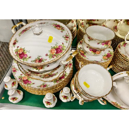 33 - Royal Albert Country Roses dinner set, including tea pot, eight soup bowls, twelve tea cups and sauc... 