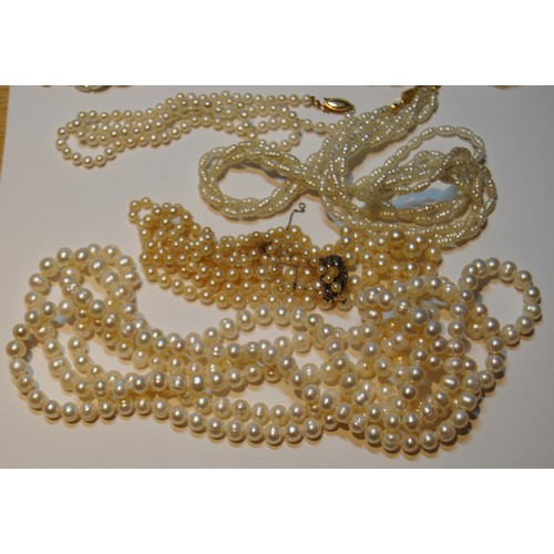 52 - Cultured pearl two-strand necklace and similar items, some with gold beads.