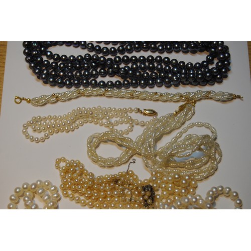 52 - Cultured pearl two-strand necklace and similar items, some with gold beads.