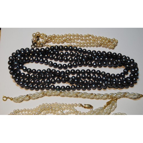 52 - Cultured pearl two-strand necklace and similar items, some with gold beads.