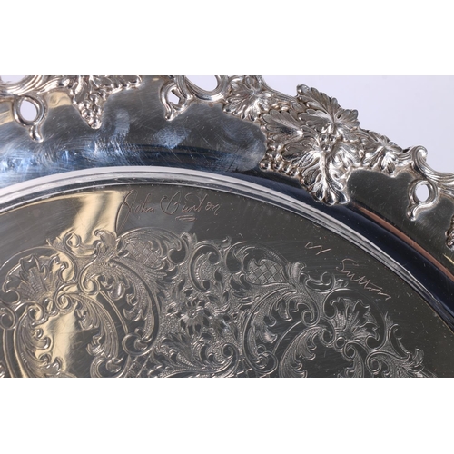 377 - Teachers whisky interest, a silver plated salver tray with fruiting grape vine border, the central c... 