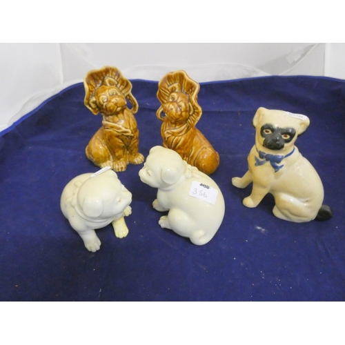 356 - Various Staffordshire pug ornaments.