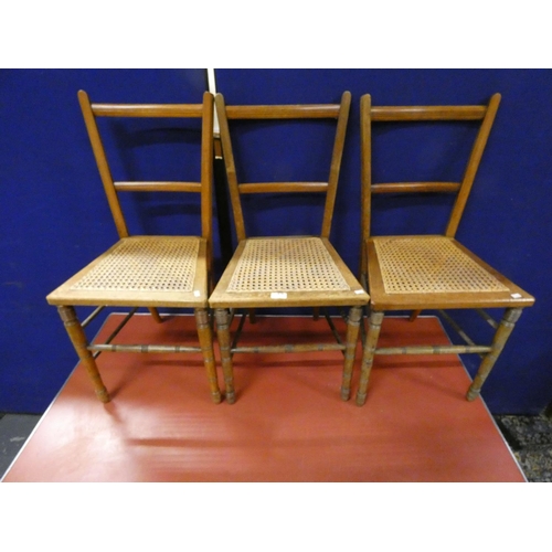 476 - Three country style dining chairs, cane seat.