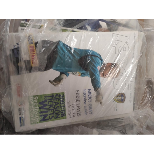 306 - Carton containing a large collection of Leeds United football programmes dating from the 2006 to 201... 