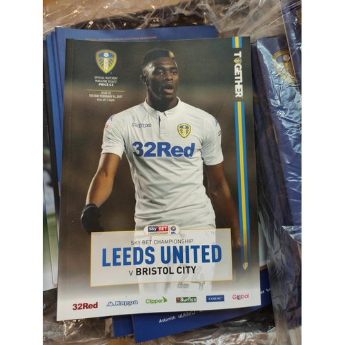 313 - Carton containing a large collection of Leeds United football programmes mostly dating from the 1990... 