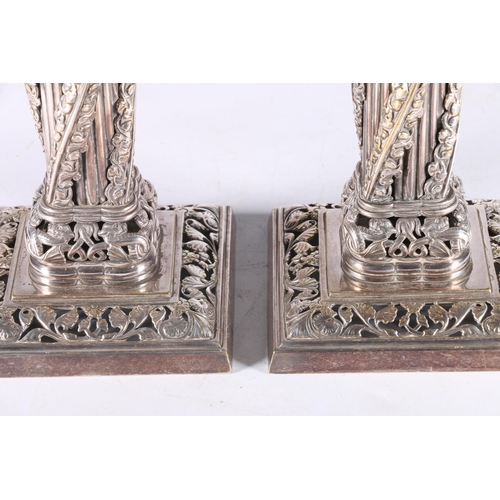 740 - Masonic interest, a pair of Catspaw Patent silver-plated candlesticks in the form of the Apprentice ... 