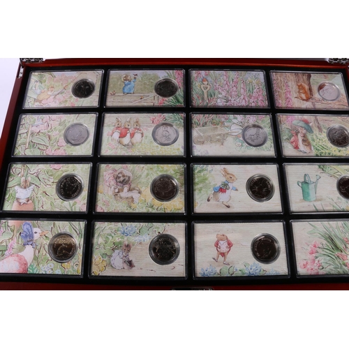 608 - The Danbury Mint The World of Beatrix Potter fifty pence collection comprising fourteen 50p coins, e... 