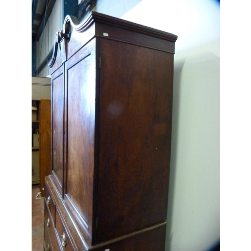 345 - 19th century Gillows-style mahogany linen press, the scroll pediment above two doors, two short and ... 