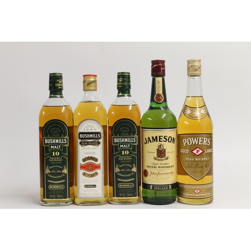 339 - Five bottles of Irish whisky including two bottles of BUSHMILLS Malt 10 year old single malt whiskey... 